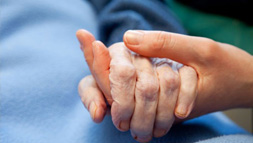 Holding hands with elder